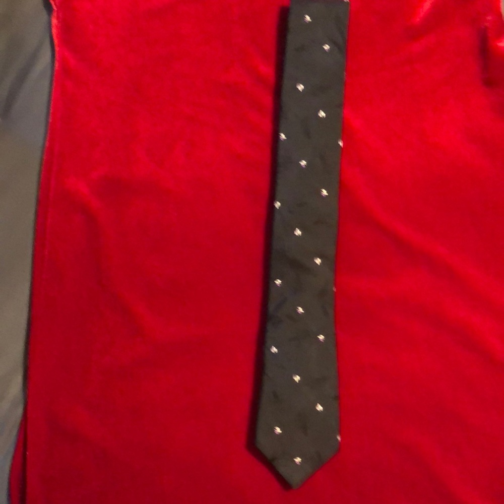 Linear Dimensions 100% European silk tie. Approximately 2.75” wide. Black